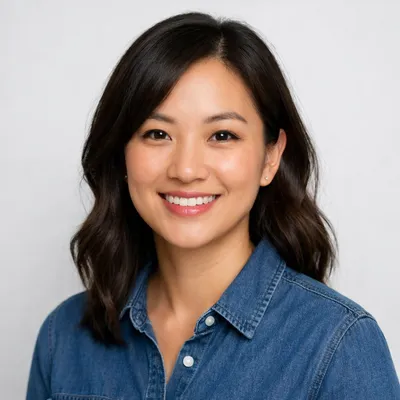Photorealistic avatar of diverse adult in neat attire on light gray background, warm expression